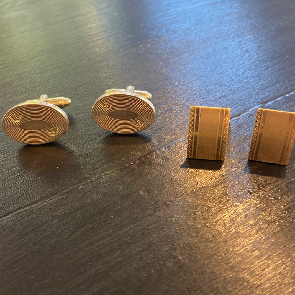 Two pairs of cufflinks.  Oval is silver Rectangle is gold tone